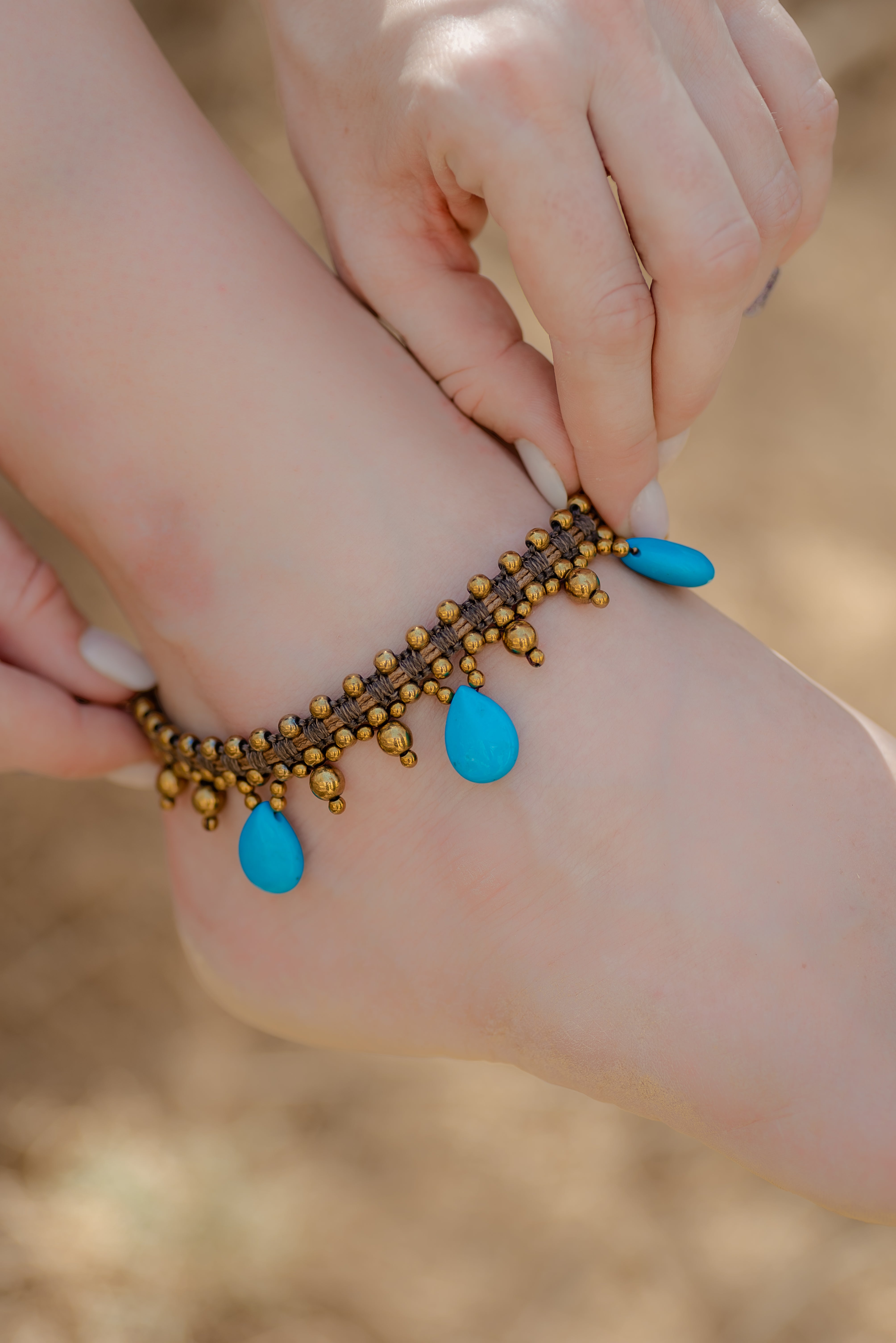 Turquoise howlite with gold hematite with leather macramé anklet.