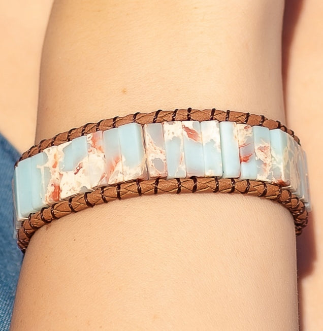 Blue sea sediments jasper bracelet wrapped with leather.